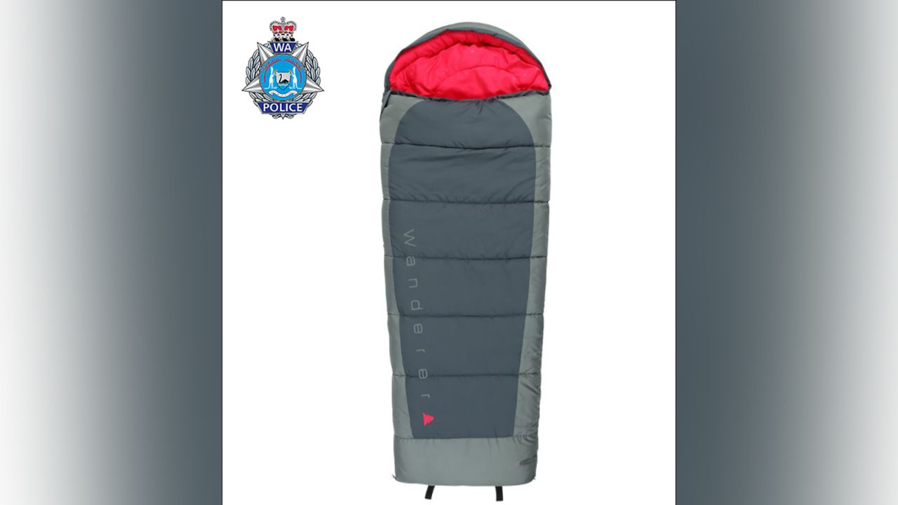 Cleo was last seen sleeping in a red and black sleeping bag.