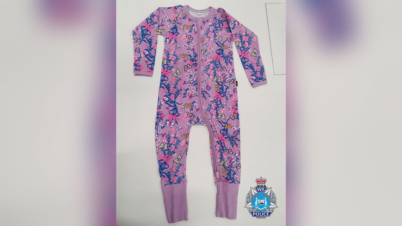 Cleo was last seen sleeping wearing a pink/purple one-piece sleep-suit with a blue and yellow pattern.