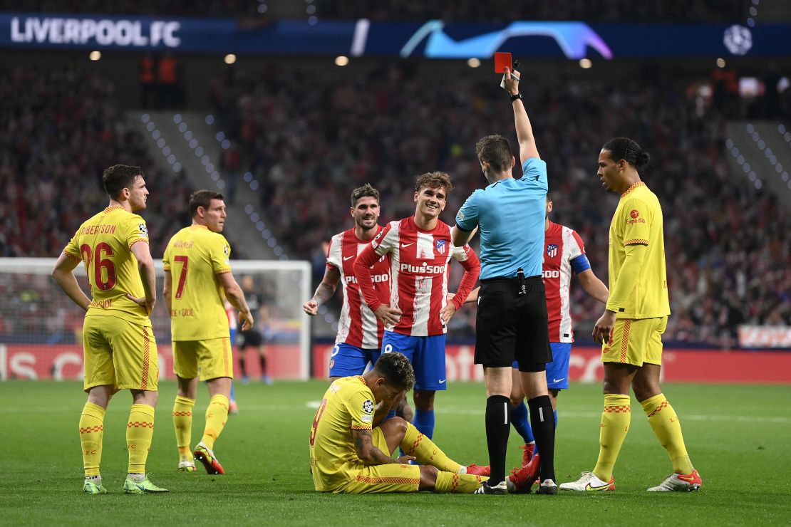 Antoine Griezmann is shown a red card by referee Daniel Siebert.