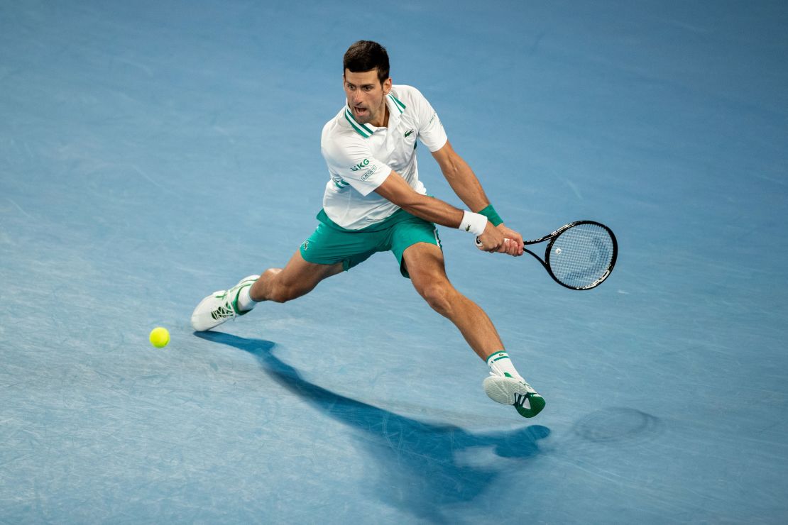 Novak Djokovic plays a backhand in the Australian Open men's final against Daniil Medvedev at Melbourne Park on February 21, 2021 in Melbourne, Australia.