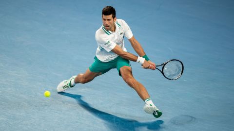 Novak Djokovic plays a backhand in the Australian Open men's final against Daniil Medvedev at Melbourne Park on February 21, 2021 in Melbourne, Australia.