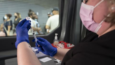 A health care worker prepares a COVID-19 vaccine in New York on July 20, 2021. 