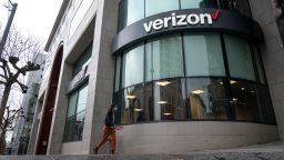 A pedestrian wearing a protective mask walks past a Verizon store in San Francisco, California, U.S., on Thursday, Jan. 21, 2021. Verizon Communications Inc. is expected to release earnings figures on January 26. Photographer: David Paul Morris/Bloomberg via Getty Images