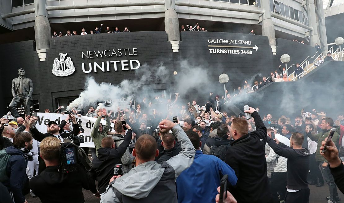 Newcastle United supporters celebrate outside St. James' Park on October 7, after the sale of the football club to a Saudi-led consortium was confirmed.