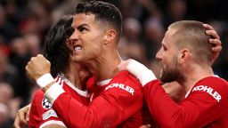 MANCHESTER, ENGLAND - OCTOBER 20: Cristiano Ronaldo of Manchester United celebrates with teammates Luke Shaw and Edinson Cavani after scoring their side's third goal during the UEFA Champions League group F match between Manchester United and Atalanta at Old Trafford on October 20, 2021 in Manchester, England. (Photo by Naomi Baker/Getty Images)