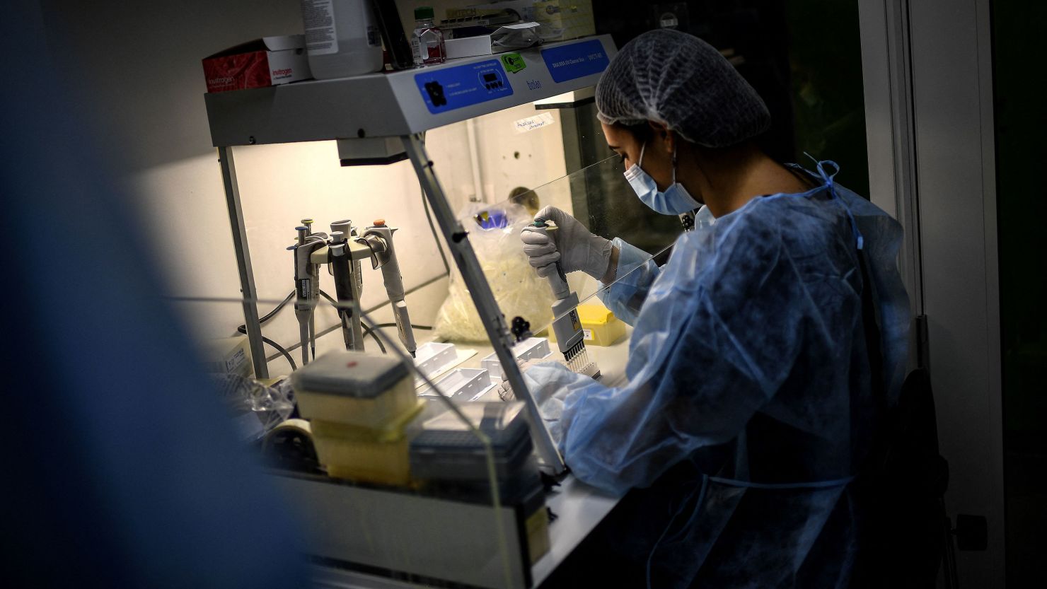 A laboratory technician works on the genome sequencing of the SARS-CoV-2 virus at the National Reference Center of respiratory infections viruses of the Pasteur Institute in Paris on January 21, 2021. 