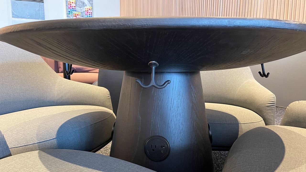 Many tables offer power outlets and hooks