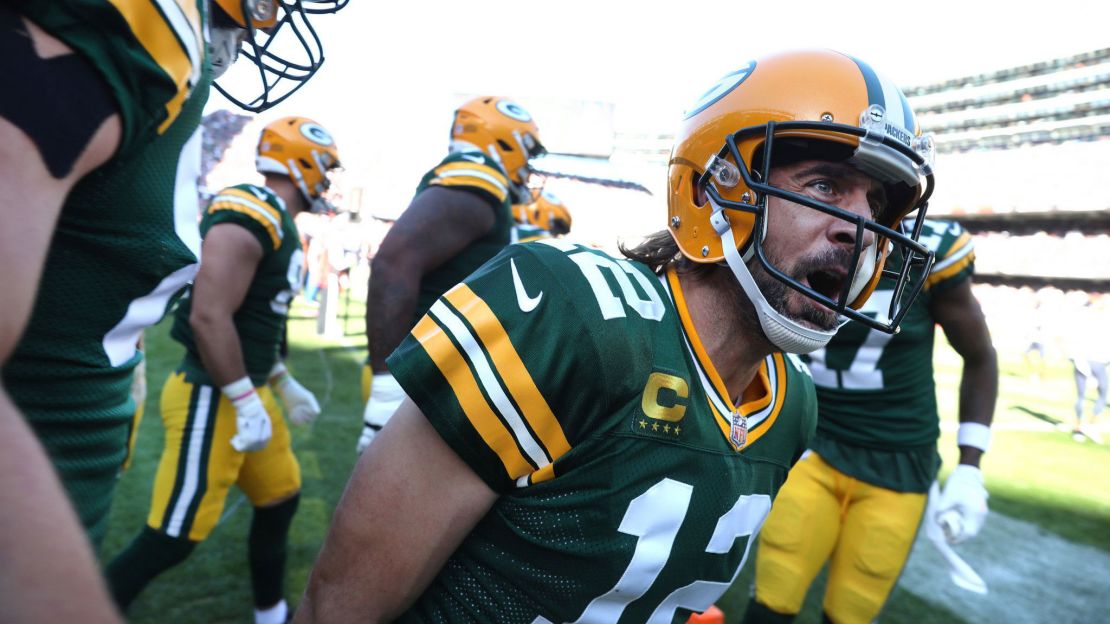 Rodgers celebrates with his teammates after rushing for a touchdown.