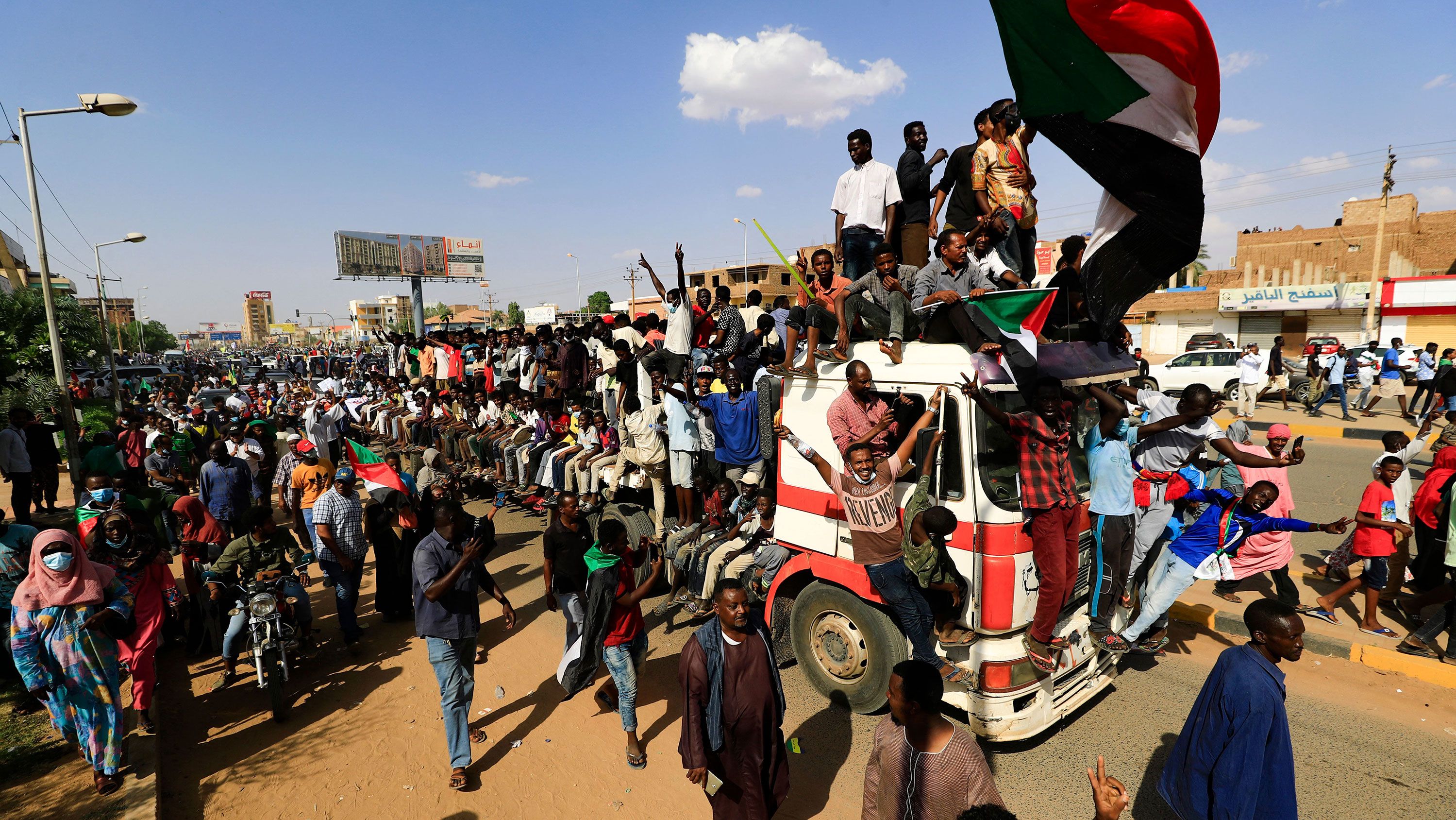 Sudanese demonstrators take to the streets of the capital Khartoum to demand the government's transition to civilian rule on October 21.