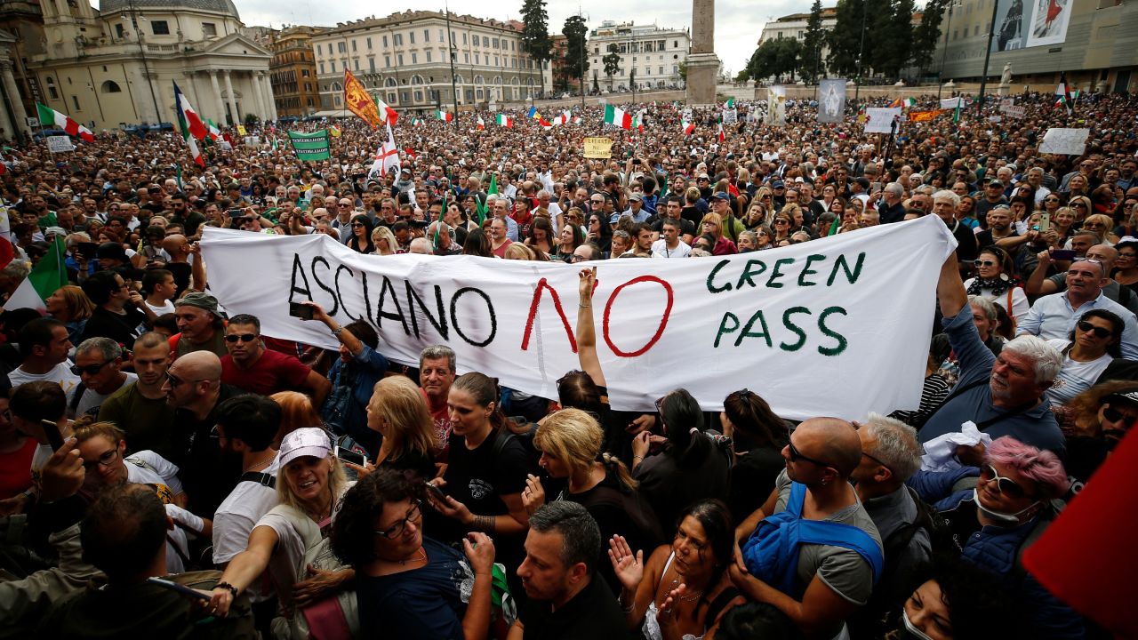 People gather in Piazza del Popolo square during a protest against the Covid-19 health pass, in Rome, Saturday, October 9, 2021. 