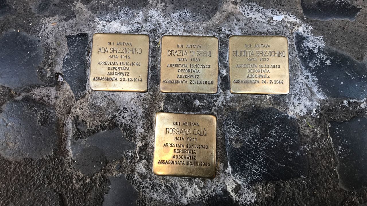 Gold cobblestones outside front doors in Rome's Jewish Ghetto commemorate people arrested and deported to Auschwitz. Two-year-old Rossana Calo was one of those.