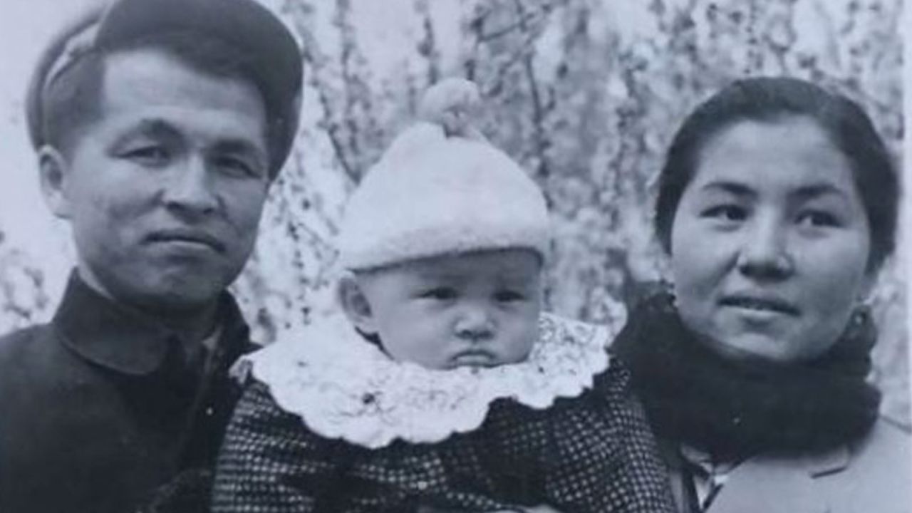 Ablikim and Ayshem Turkel hold Nury Turkel, their baby, in spring 1971, shortly after Nury and his mother were released from a Chinese "reeducation camp."