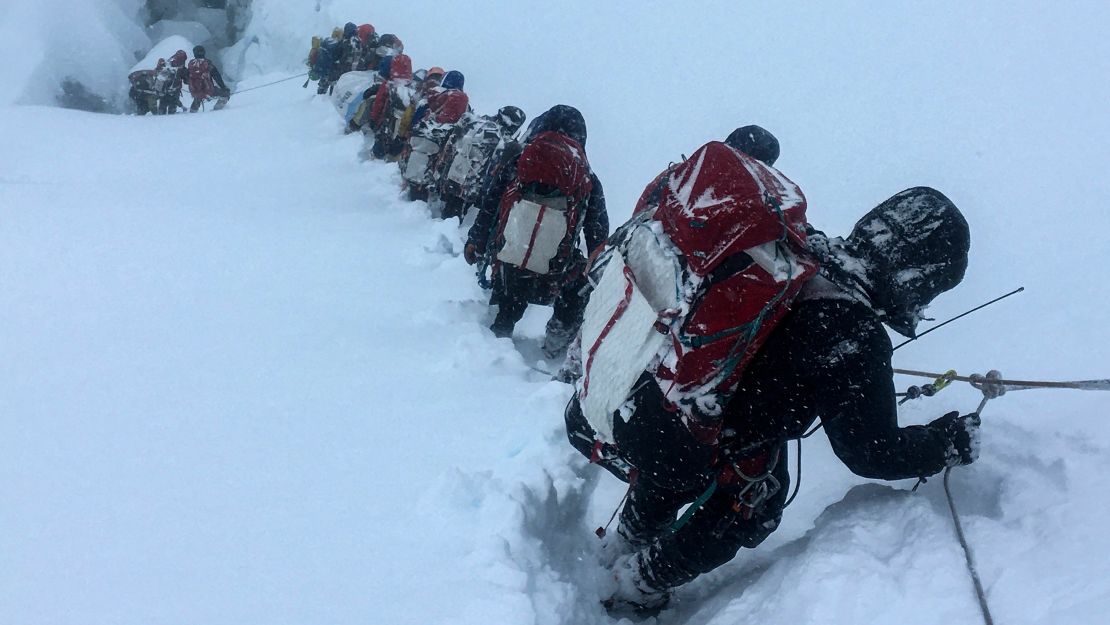 Mountaineers descending from the summit of Mount Everest in June 2021. 