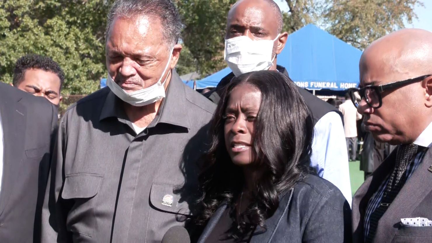 Carmen Bolden Day, center, is urging the FBI to get involved in the investigation of her son Jelani Day's death. The Rev. Jesse Jackson, left, joined her during Day's funeral earlier this week.