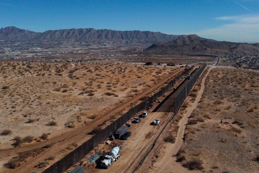 Aerial view of US workers building the new 13-mile border wall construction project at the desert between Sunlad Park, New Mexico, US and Ciudad Juarez, Chihuahua state, Mexico on January 15, 2021. (Photo by HERIKA MARTINEZ / AFP) (Photo by HERIKA MARTINEZ/AFP via Getty Images)