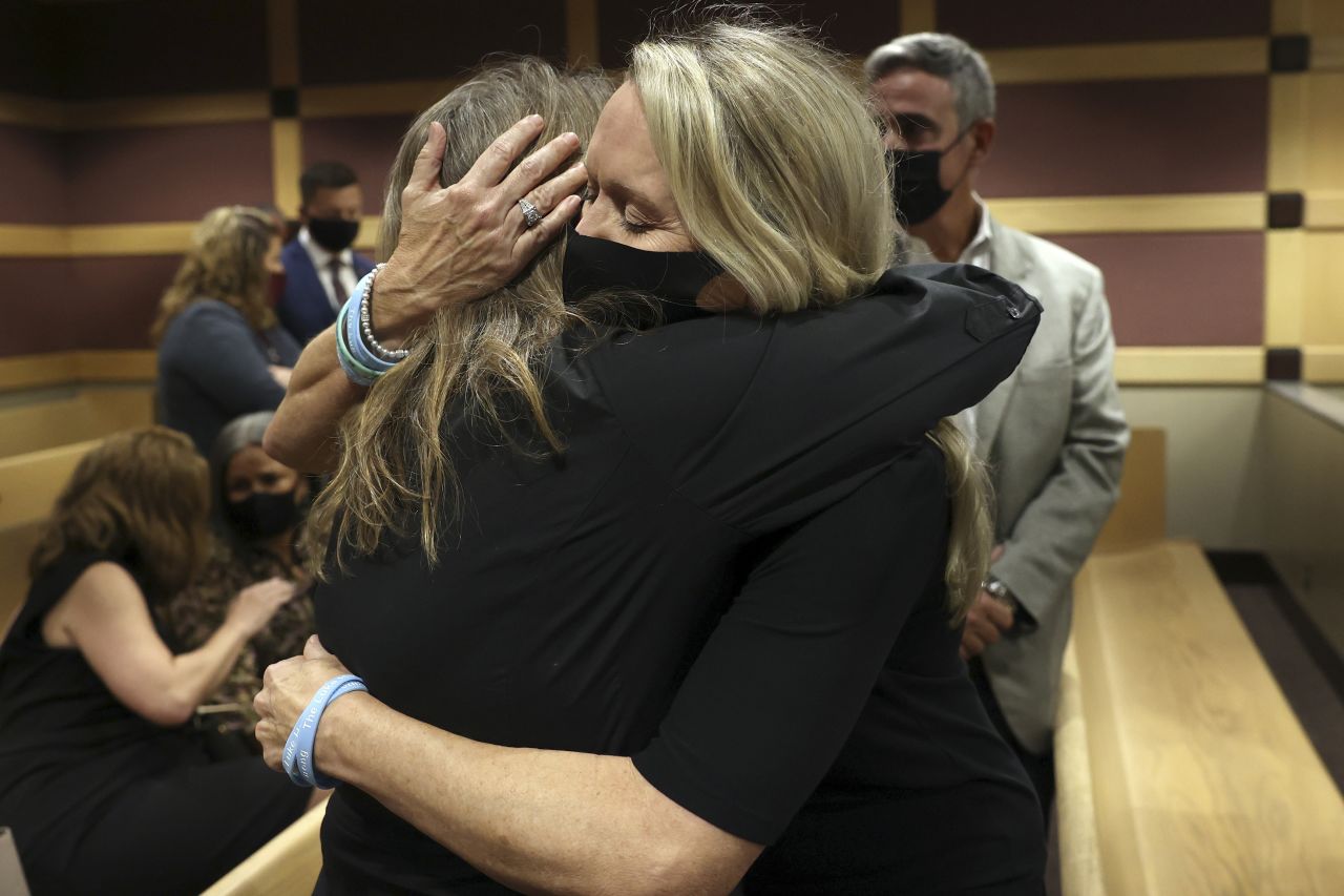 Gena Hoyer, right, hugs Debbi Hixon after <a href="http://cnn.com/2021/10/20/us/nikolas-cruz-parkland-shooting-guilty/index.html" target="_blank">Nikolas Cruz</a>, the gunman who carried out the massacre at <a href="https://edition.cnn.com/2020/02/14/us/parkland-shooting-marjory-stoneman-douglas-2-years/index.html" target="_blank">Marjory Stoneman Douglas High School</a> in 2018, pleaded guilty to 17 counts of murder and 17 counts of attempted murder at Broward County Courthouse on Wednesday, October 20. Hoyer's Son, Luke, and Hixon's husband, Christopher, were both killed in the 2018 shooting.