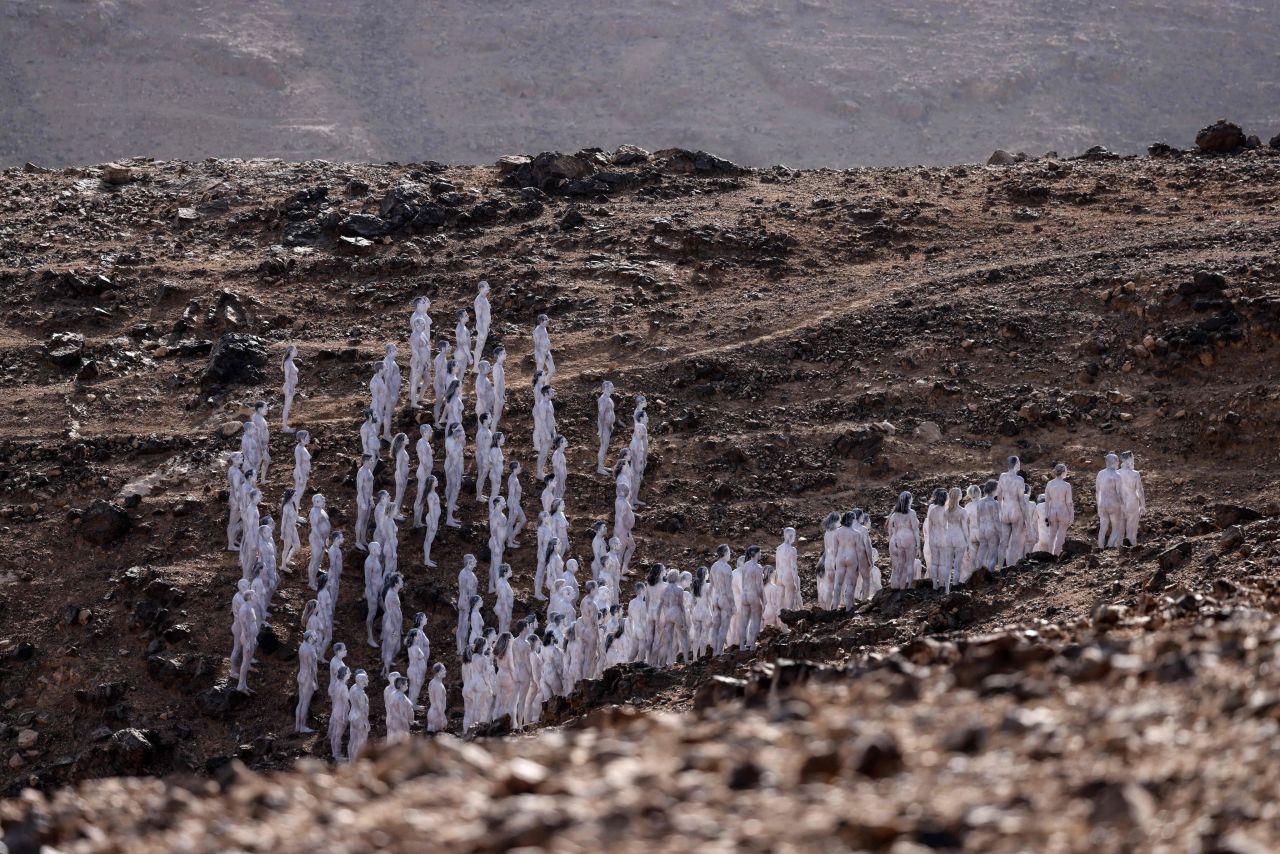People pose nude for photographer <a href="https://www.cnn.com/style/article/spencer-tunick-dead-sea-nude-photographs/index.html" target="_blank">Spencer Tunick</a> in the desert surrounding the southeastern Israeli city of Arad, on Sunday, October 17. Hundreds of participants took part in Tunick's nude photo installation that is designed to draw attention to preserving and restoring the Dead Sea.