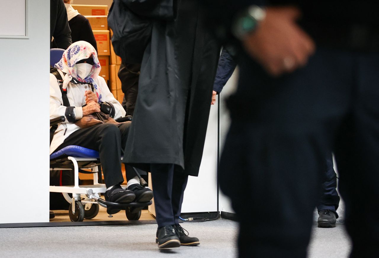 A 96-year-old former Nazi concentration camp secretary, named by German media as Irmgard Furchner, is led into a courtroom at the start of her trial in Itzehoe, Germany, on Tuesday, October 19. <a href="https://www.cnn.com/2021/10/19/europe/german-nazi-war-crimes-trial-96-year-old-intl/index.html" target="_blank">Furchner</a> is accused of being an accessory to murder in more than 11,000 cases, when she was a stenographer and typist in the commandant's office at the Stutthof camp in Nazi-occupied Poland.
