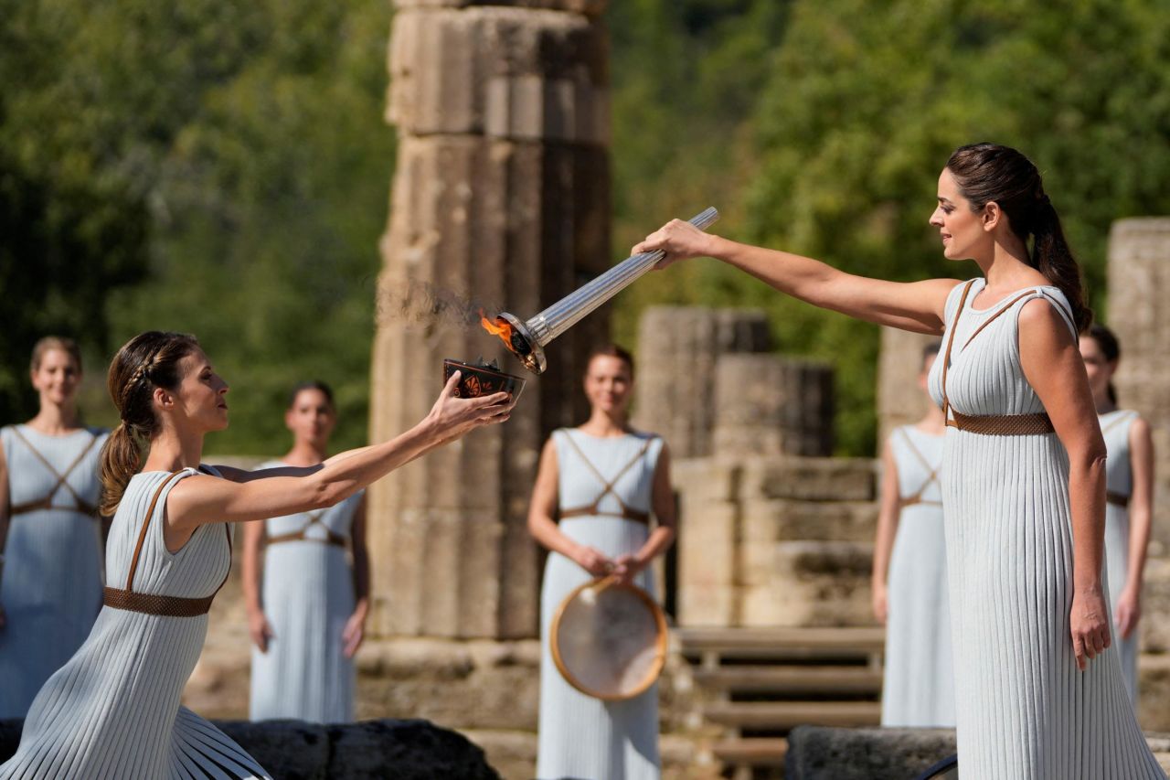 Greek actress Xanthi Georgiou lights the torch during the flame-lighting ceremony for the Beijing 2022 Winter Olympics at the Ancient Olympia archeological site, birthplace of the ancient Olympics, in Greece on Monday, October 18.