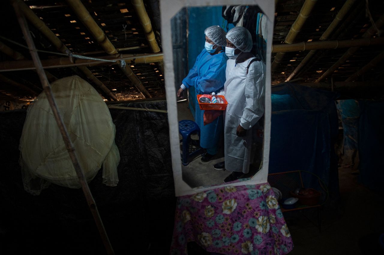 Healthcare workers prepare to inoculate people with the AstraZeneca/Oxford Covid-19 vaccine in the Buenos Aires District of Peru, on Monday, October 18.