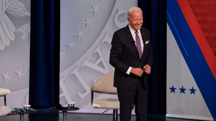 US President Joe Biden with CNN anchor and host Anderson Cooper at CNN's Presidential Town Hall with Joe Biden in Baltimore, Maryland, on October 21, 2021.