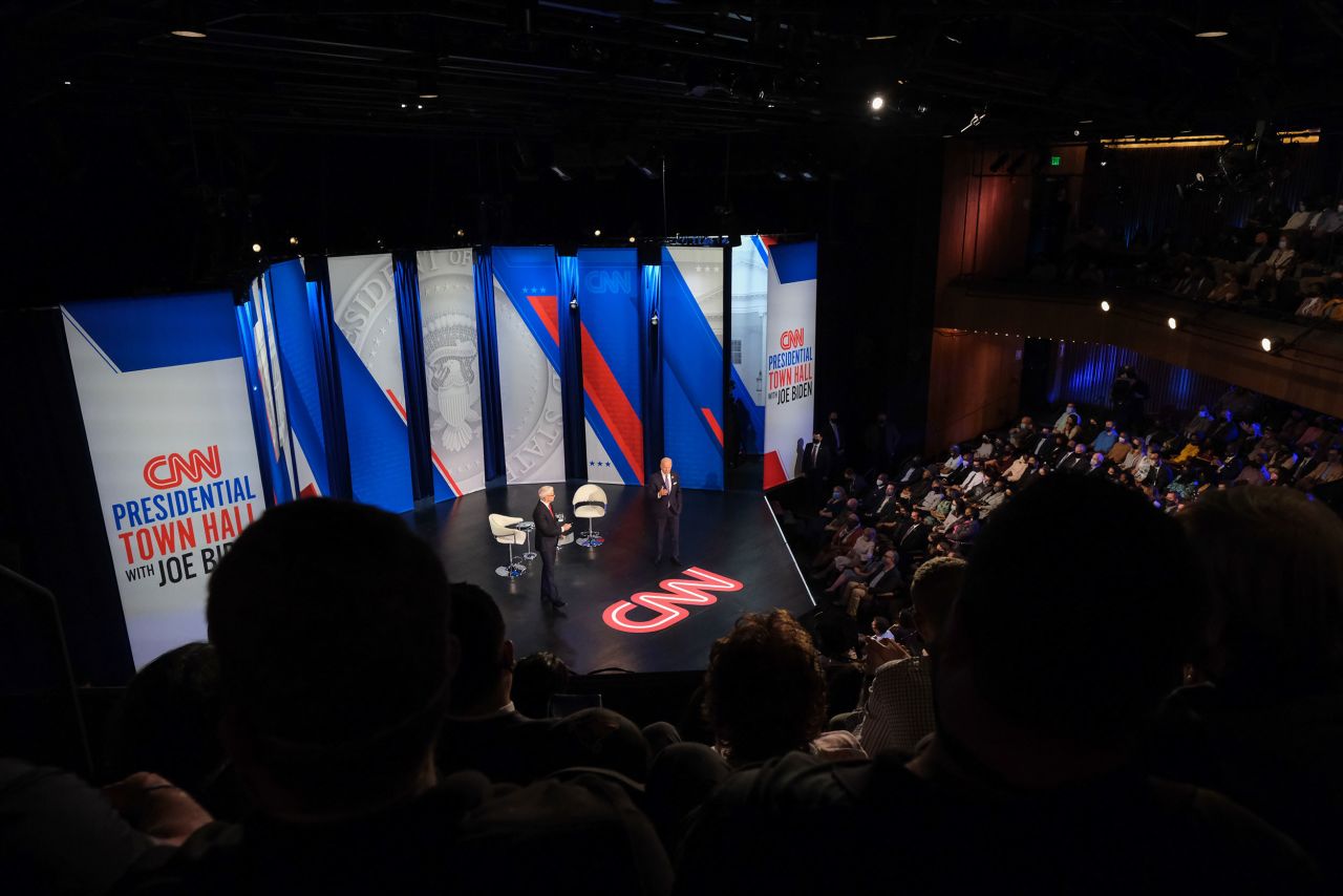 President Joe Biden, right, and CNN anchor Anderson Cooper, speak during a CNN town hall in Baltimore, Maryland, on Thursday, October 21.