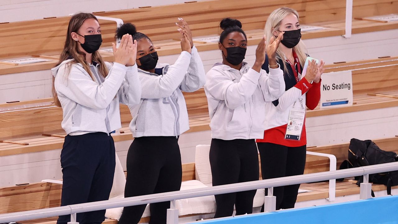 Simone Biles and her teammates cheer during the Tokyo Olympics on July 29 in Japan.