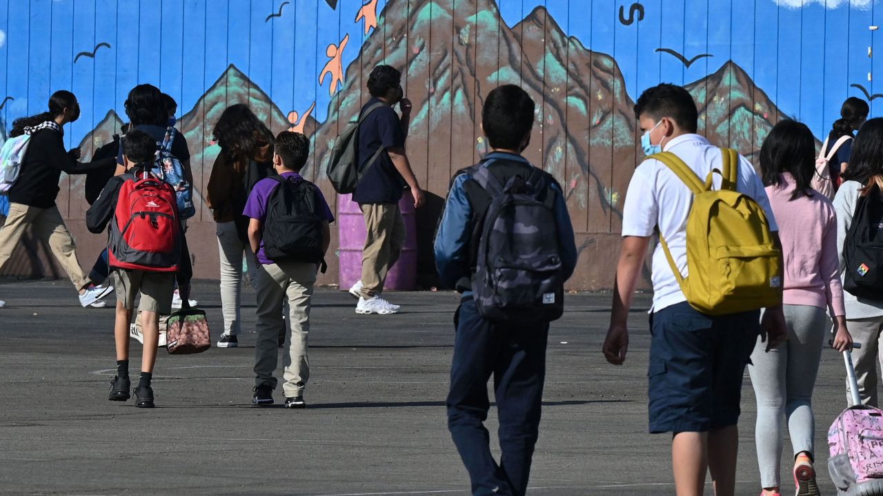 The return of in-person classes means kids may need help shaking off some social awkwardness. Students at a public middle school in Los Angeles are shown, September 10.