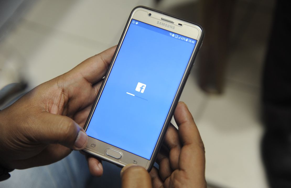 An Indian man is shown using Facebook on his cellphone in Siliguri on March 27, 2018.