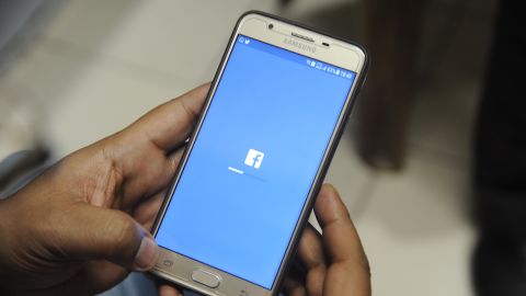 An Indian man is shown using Facebook on his cellphone in Siliguri on March 27, 2018.