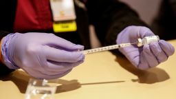 Registered nurse Florisa N. Lingad prepares a dose of a Johnson & Johnson Covid-19 vaccine at a vaccination center established at the Hilton Chicago O'Hare Airport Hotel in Chicago, Illinois, on March 5, 2021. - The Hilton Chicago O'Hare Airport Hotel will provide the single-dose Johnson & Johnson shot to airport employees and other public transit workers with agencies such as the CTA, Metra and PACE, as well as taxi and ride share drivers. Approximately 500 individuals will be vaccinated each day starting this month. (Photo by KAMIL KRZACZYNSKI / AFP) (Photo by KAMIL KRZACZYNSKI/AFP via Getty Images)