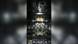 Teams at NASA's Kennedy Space Center in Florida lifted the Orion spacecraft and placed it atop the Space Launch System (SLS) Moon rocket, completing assembly for the Artemis I flight test. The spacecraft, complete with its launch abort system, was secured in place Oct. 21, 2021, and teams will begin conducting a series of tests on the fully assembled Moon rocket, now standing 322 feet tall, ahead of launch. The mission, known as Artemis I, will pave the way for a future flight test with crew before NASA establishes a regular cadence of more complex missions with astronauts on and around the Moon. With Artemis, the agency will land the first woman and the first person of color on the surface of the Moon, paving the way for a long-term lunar presence and serving as a steppingstone on the way to Mars.