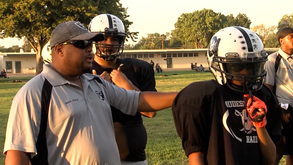 Jasen and his father, Jasen Bracy Sr., during a game.