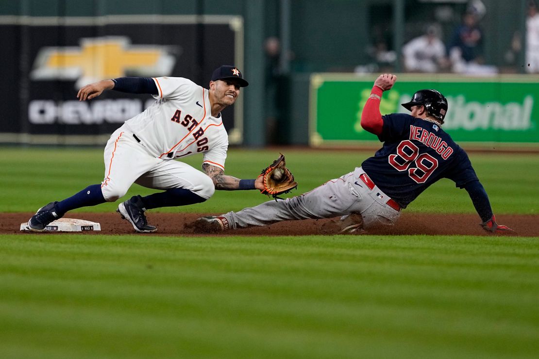 Houston Astros shortstop Carlos Correa tags out Boston Red Sox's Alex Verdugo at second to end the top of the seventh inning on Friday