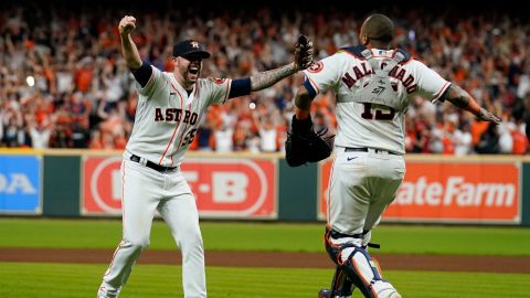Houston Astros catcher Martin Maldonado and relief pitcher Ryan Pressly celebrate their win against the Boston Red Sox in Game 6 on Friday night in Houston.