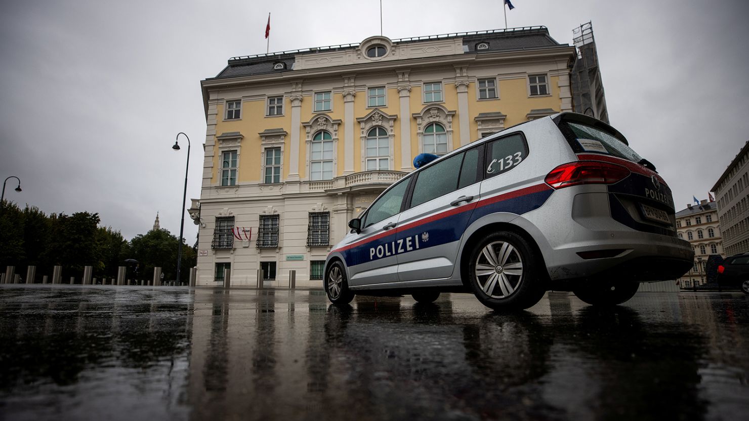 A police car parks in front of the Austrian federal chancellery in Vienna, Austria October 7, 2021.