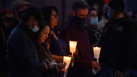 People hold candles as they attend a vigil held to honor cinematographer Halyna Hutchins at Albuquerque Civic Plaza on October 23 in Albuquerque, New Mexico. 