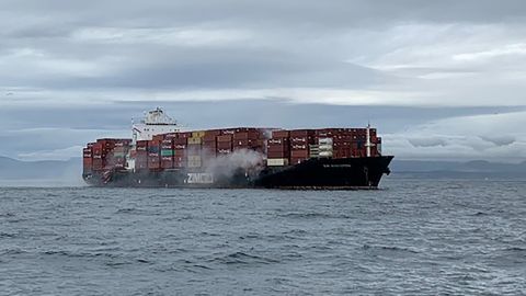 Smoke rises from the container ship Zim Kingston, off the coast of Victoria, British Columbia, on October 23, 2021.
