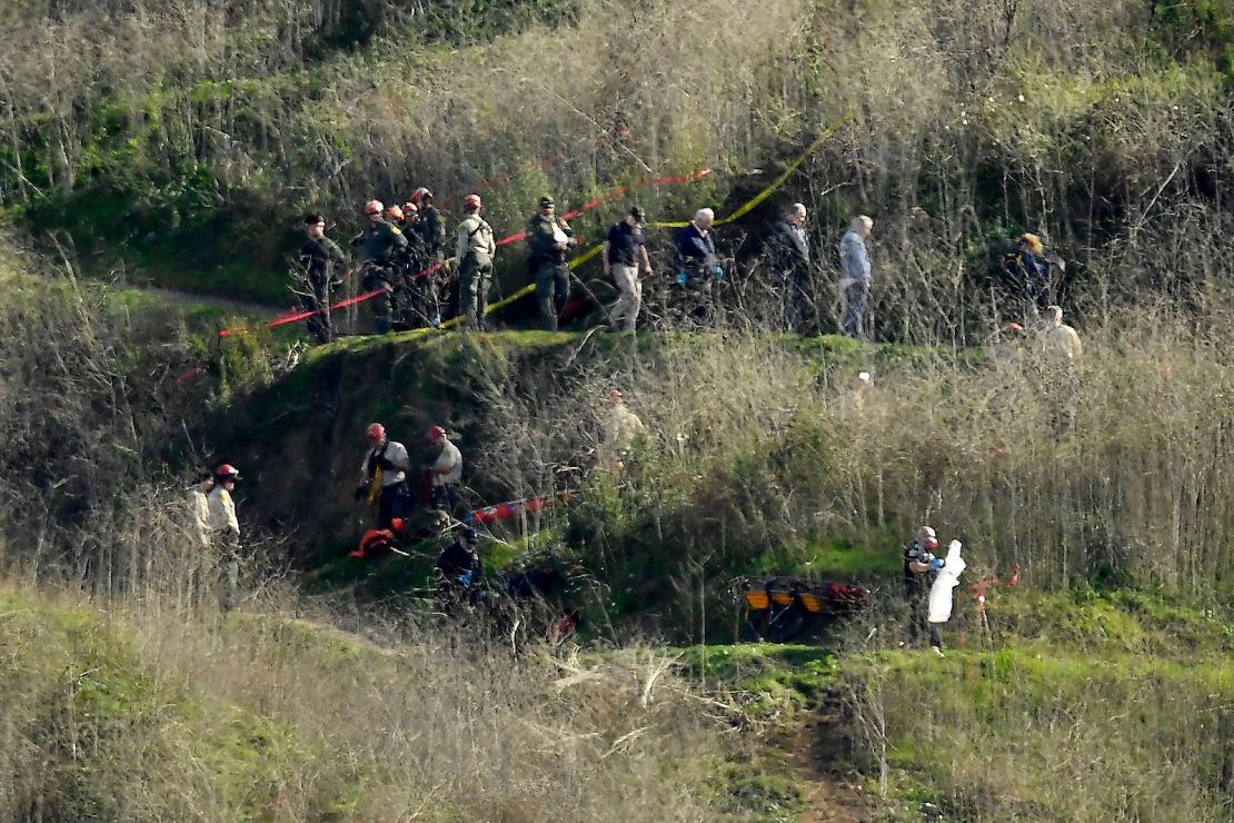 Investigators work the scene of a January 2020 helicopter crash that killed Kobe Bryant, his daughter Gianna and seven other people in Calabasas, California.