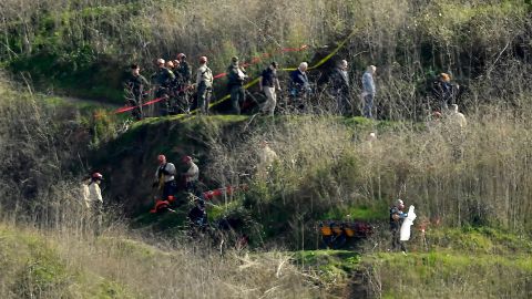 Investigators work the scene of a January 2020 helicopter crash that killed Kobe Bryant, his daughter Gianna and seven other people in Calabasas, California.
