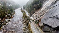 Rocks and vegetation cover Highway 70 following a landslide in the Dixie Fire zone on Sunday, Oct. 24, 2021, in Plumas County, Calif. Heavy rains blanketing Northern California created slide and flood hazards in land scorched during last summer's wildfires. (AP Photo/Noah Berger)