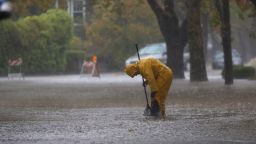 SAN RAFAEL, CALIFORNIA - OCTOBER 24: A worker attempts to clear a drain in a flooded street on October 24, 2021 in San Rafael, California. A category 5 atmospheric river is bringing heavy precipitation, high winds and power outages to the San Francisco Bay Area. The storm is expected to bring anywhere between 2 to 5 inches of rain to many parts of the area. (Photo by Justin Sullivan/Getty Images)