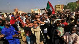 Sudanese protesters march in 60th Street in the capital Khartoum, to denounce overnight detentions by the army of members of Sudan's government, on October 25, 2021. - Armed forces detained Sudan's Prime Minister over his refusal to support their "coup", the information ministry said, after weeks of tensions between military and civilian figures who shared power since the ouster of autocrat Omar al-Bashir. (Photo by AFP) (Photo by -/AFP via Getty Images)