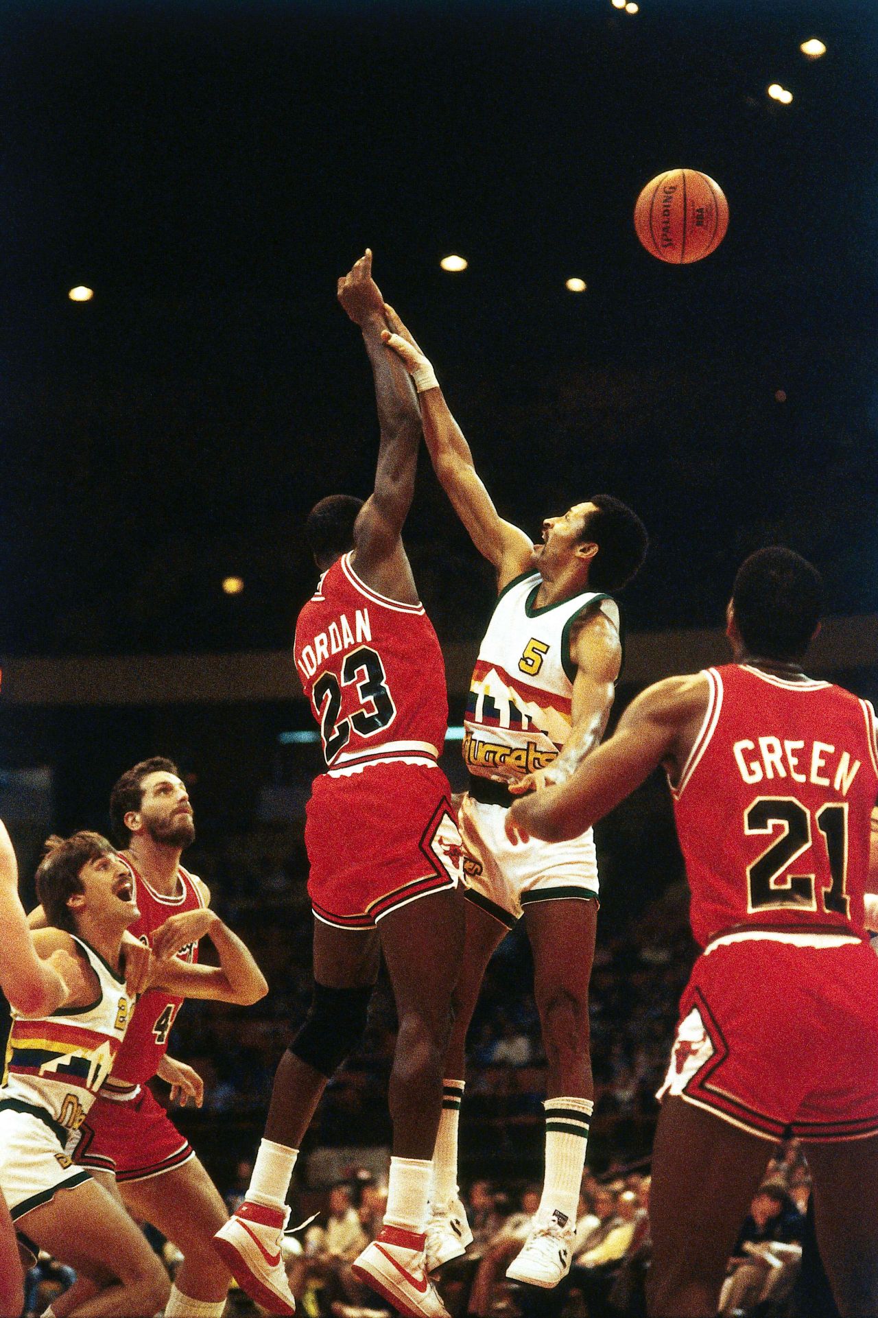 Michael Jordan playing for the Chicago Bulls during the 1984 NBA game in Denver, Colorado. 