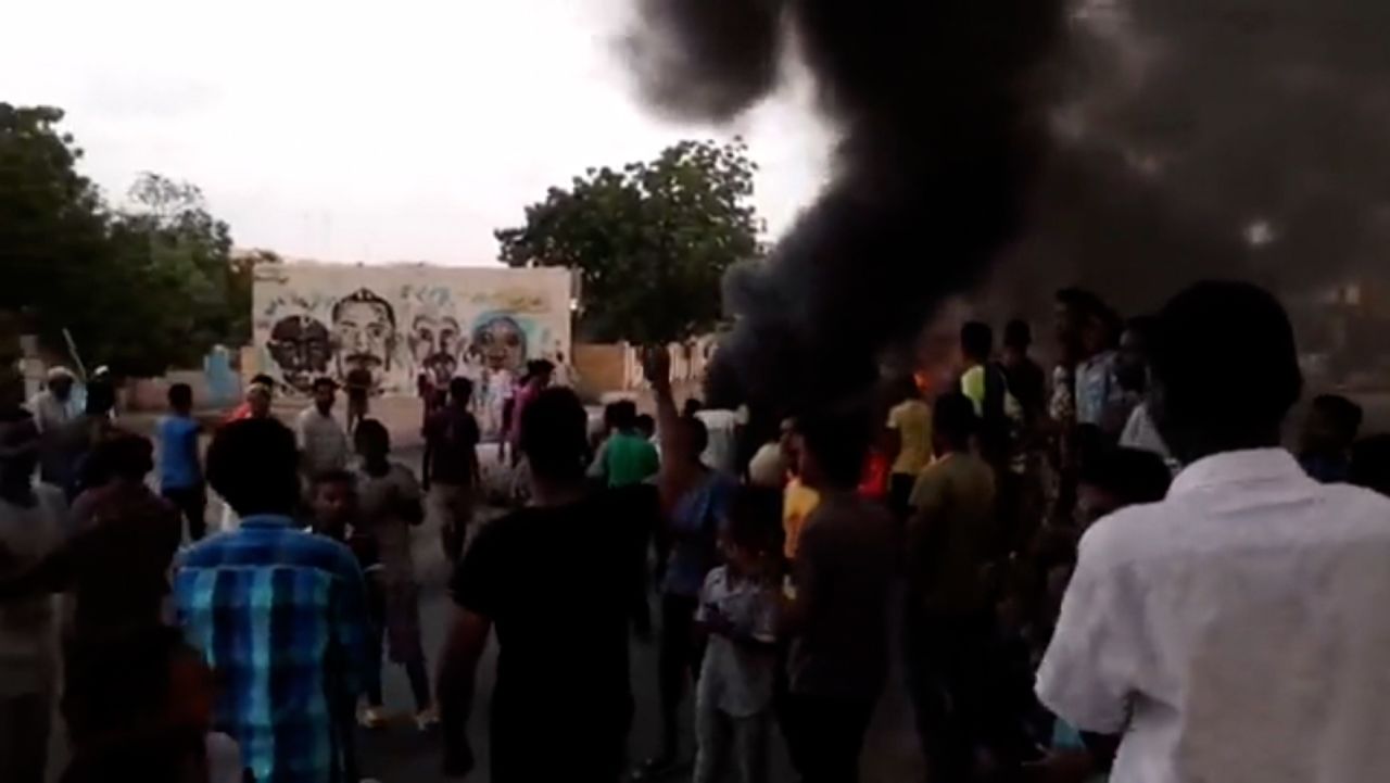 Sudanese take to streets after the country's prime minister was arrested in an apparent coup.