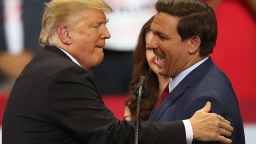 ESTERO, FL - OCTOBER 31:  President Donald Trump greets Florida Republican gubernatorial candidate Ron DeSantis during a campaign rally at the Hertz Arena on October 31, 2018 in Estero, Florida. President Trump continues traveling across America to help get the vote out for Republican candidates running for office.  (Photo by Joe Raedle/Getty Images)