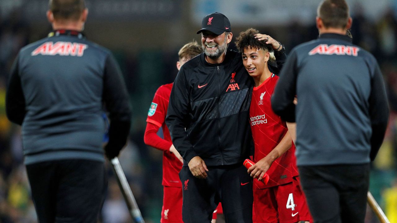 Klopp embraces Gordon after the English League Cup third round football match against Norwich City.