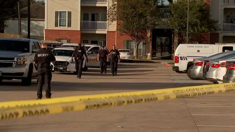 Police at the Houston apartment complex where the children were found.