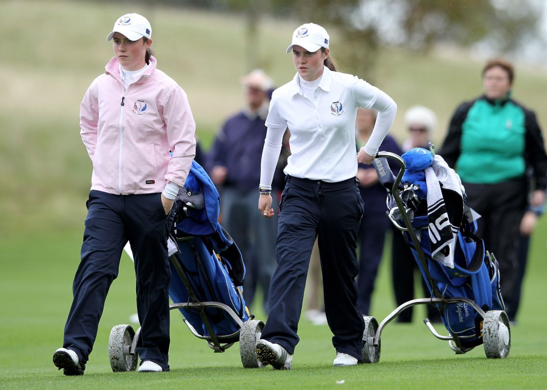 Maguire and her sister, Lisa, walk up a fairway together during the foursomes at the 2011 Junior Solheim Cup at Knightsbrook Hotel and Golf Resort on September 20, 2011 in Trim, Ireland.