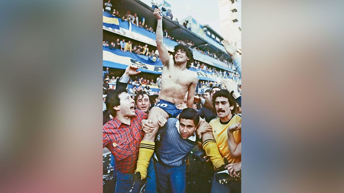 Maradona, being carried by fans after winning the 1981 local championship with Boca Juniors at La Bombonera stadium in Buenos Aires.